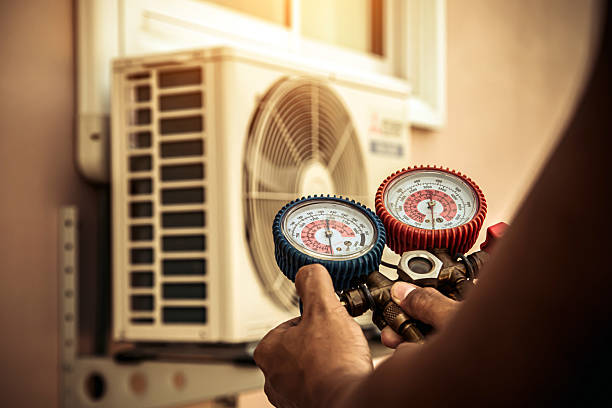 Professional Heat Pump Repair technician working in Dumont, NJ